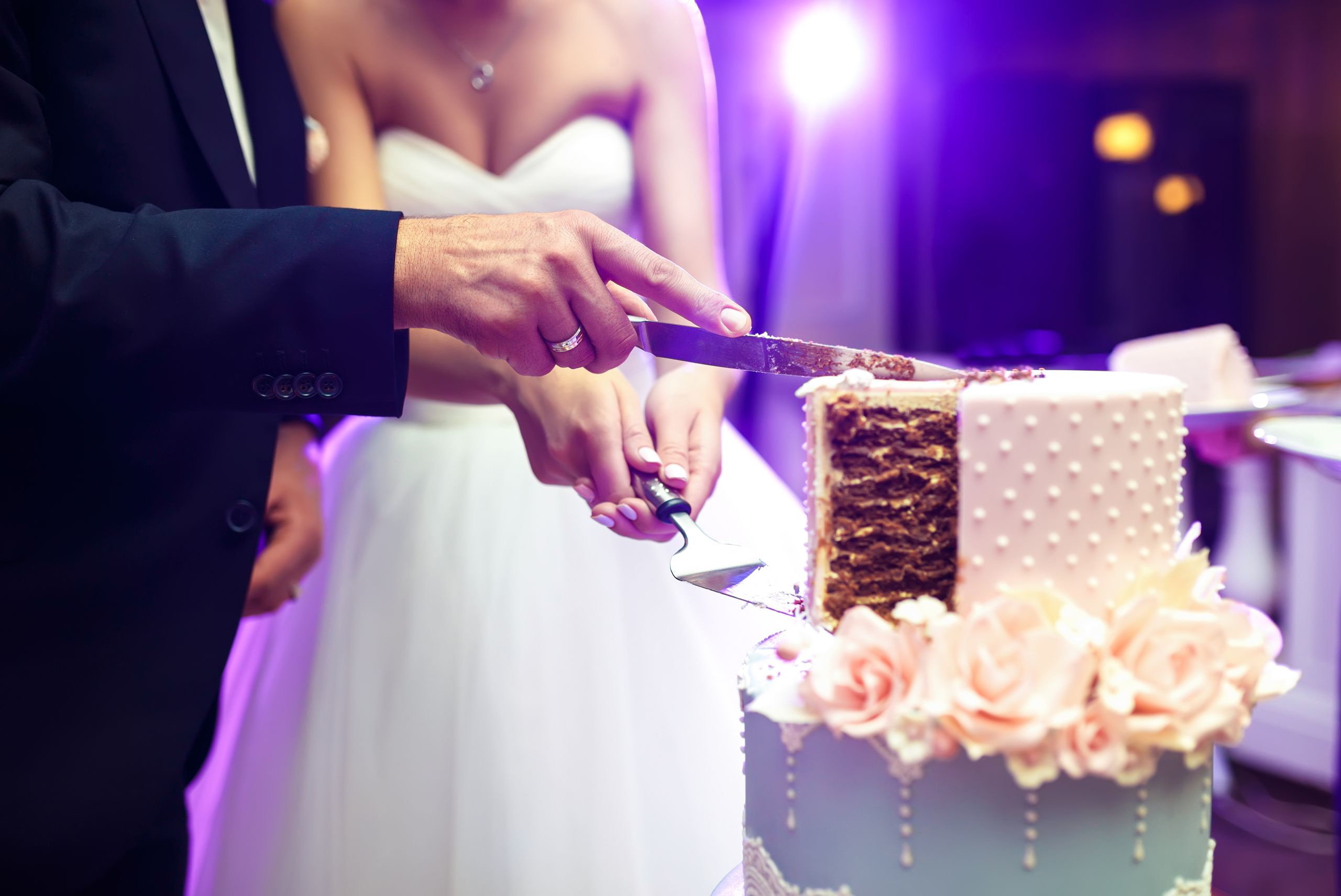 2024-12/Bride and Groom cutting Cake.jpg